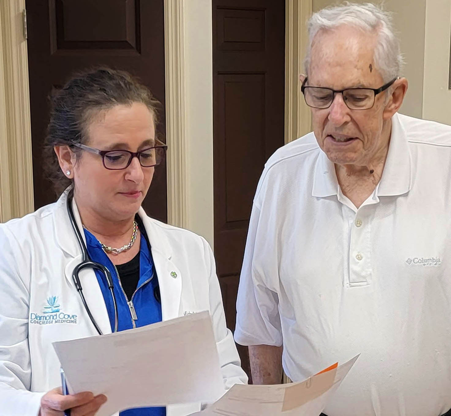Dr. Michelle Becker reviewing test results with a longtime patient